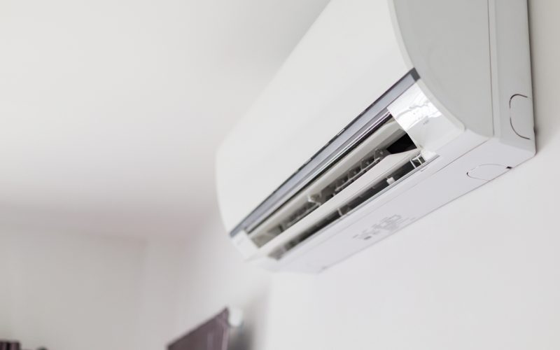 Air conditioner on white wall room interior background Air conditioner on white wall room interior background